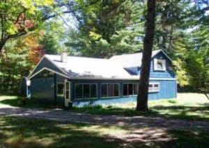 SOLD! Up North home nestled in the woods just across from the street from Higgins Lake